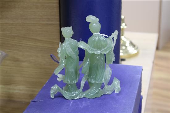 A 20th century Chinese carved bowenite jade figure of a courtesan and a similar group of a noble couple,